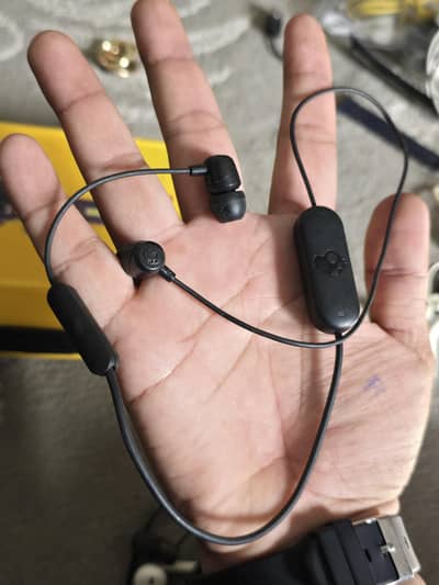 skullskandy branded neckband earphones
