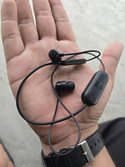 skullskandy branded neckband earphones