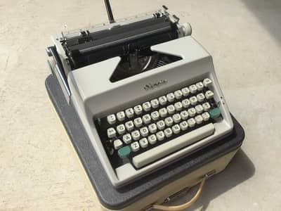 New Olympia Portable Typewriter with 6 months warranty 03004331882