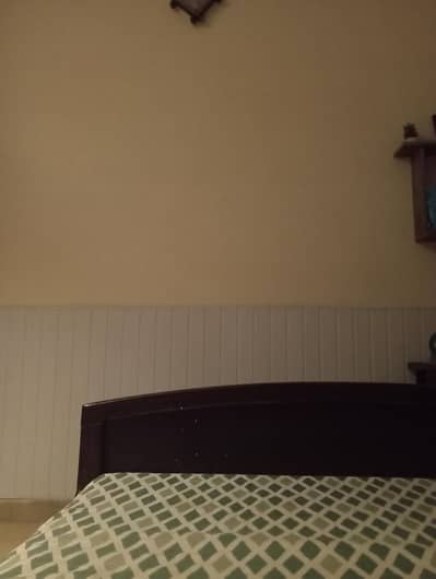 simple single bed colour is dark brown