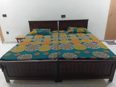 2 single beds eith mattresses