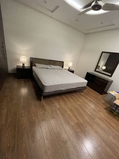 Wooden bed with dresser without mattress