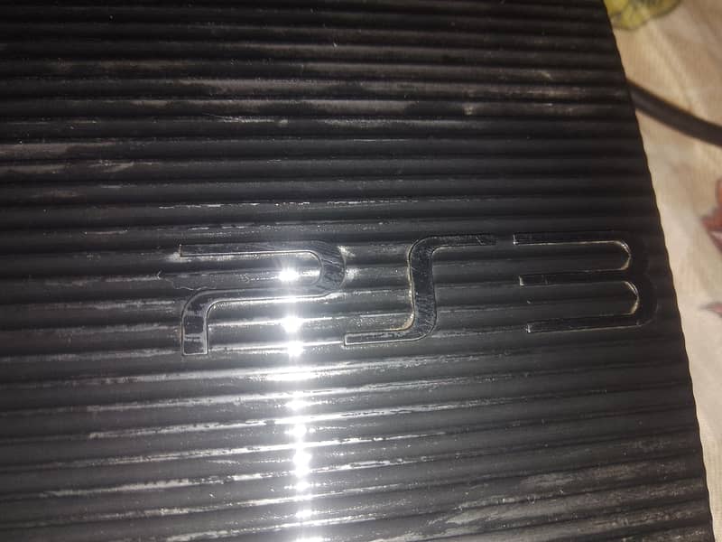 playstation3 with two controllers 0