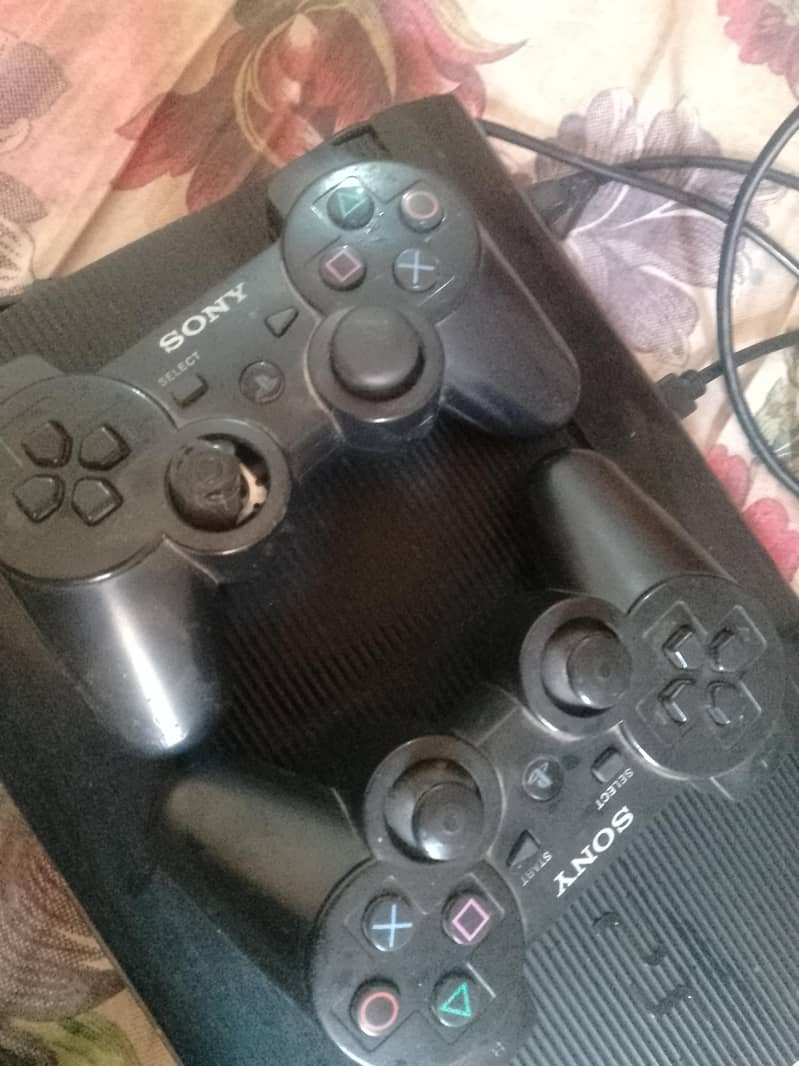 playstation3 with two controllers 2