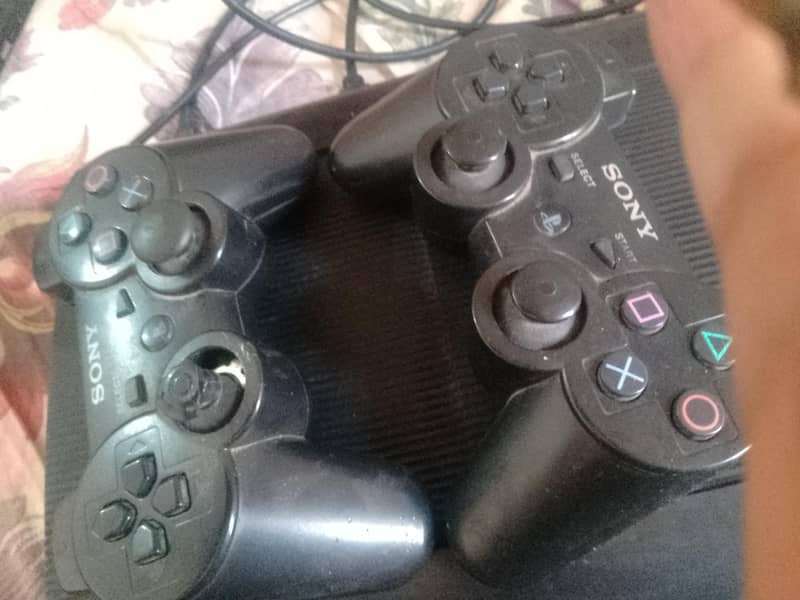 playstation3 with two controllers 3