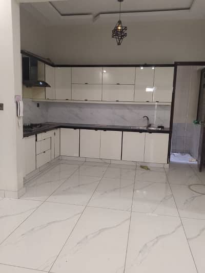 Brand New 3 bed drawing lounge ground floor portion for rent tiled flooring America kitchen tiled washrooms 24 hours water and electricity