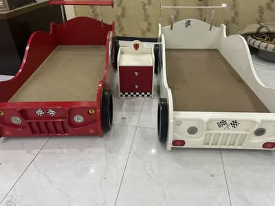Two single bed with one Center table and wheel cups