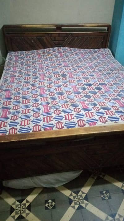wooden bed with mattress
