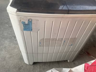 Homage washing machine with dryer
