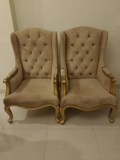 Royal winged sofa chair.