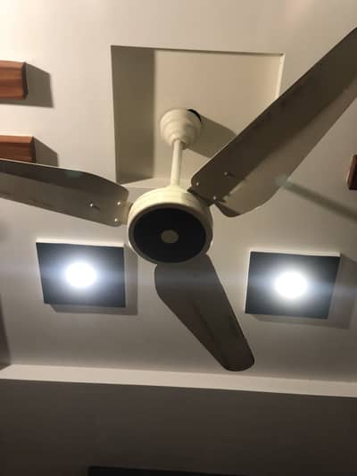 Off-white and brown selling fan,  Condition 9.5/10,  Voltage 220-230