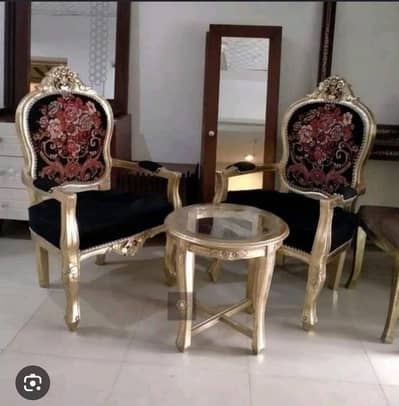2 wooden chairs with table