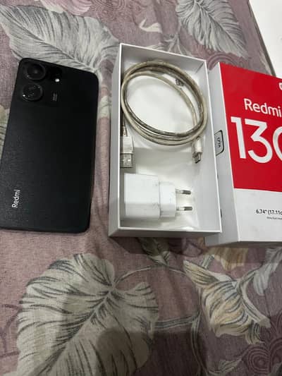 Redmi 13c with original box and charger.
