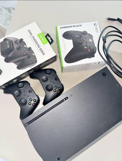Xbox Series X with two original controllers
