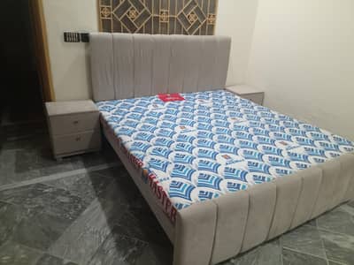 Double beds with mattress and side tables
