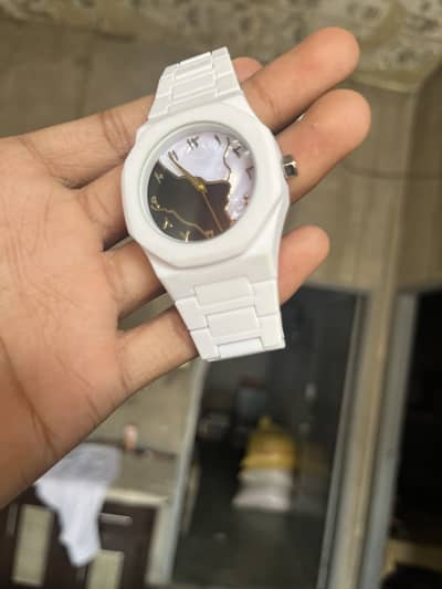 Aura watch in white colour.