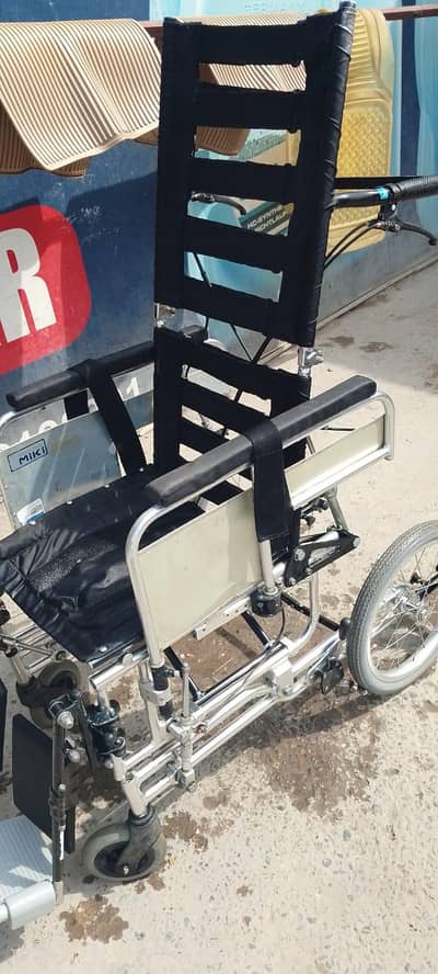 older disabled and baby chair
