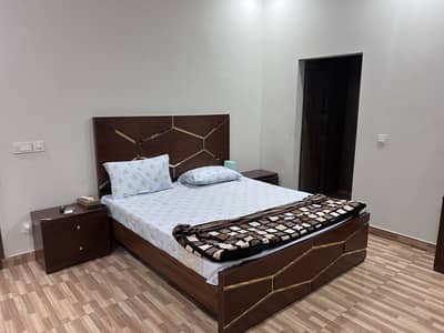 Bed set along with side tables and dressing tables