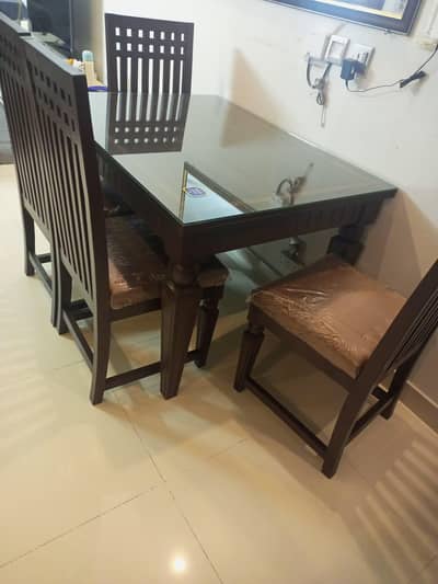 slightly used dining table with 4 chairs