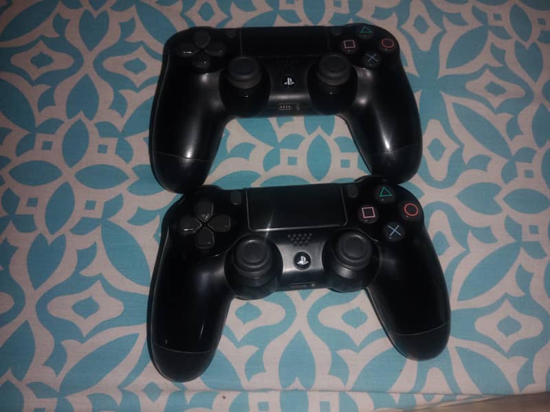 Two used PS4 controllers. 0