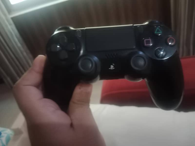 Two used PS4 controllers. 1