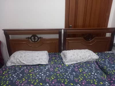Single beds with side tables
