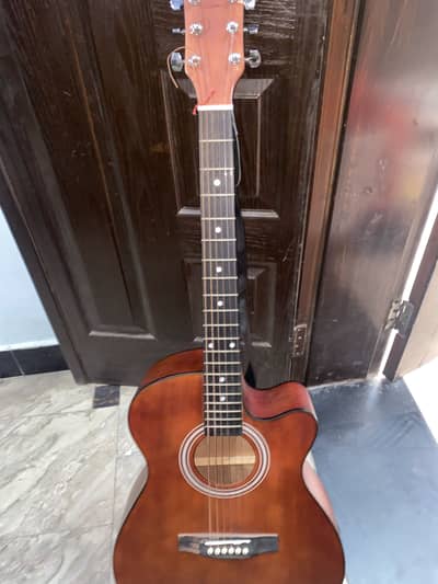 This is brown 38 inch acoustic guitar with a cutaway body design