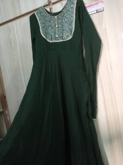 dark green long length stiched frok with golden dupatta