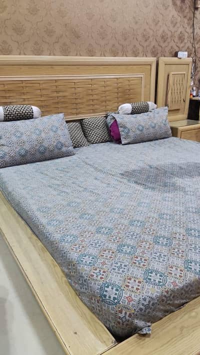 King size bed and side table without mattress