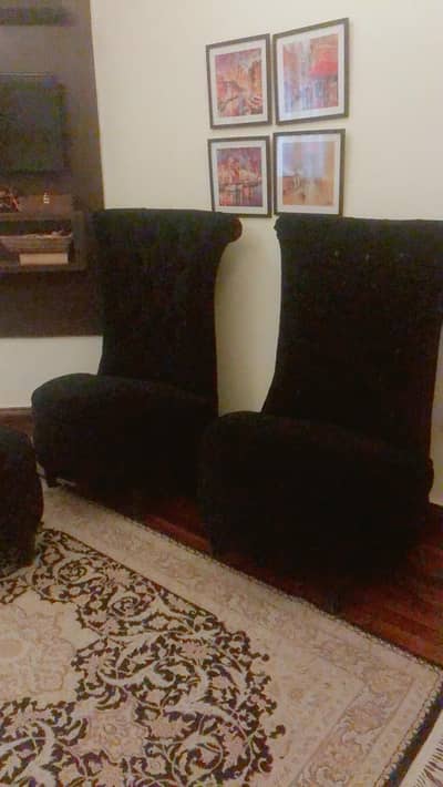 Black sofa chairs with coffee table