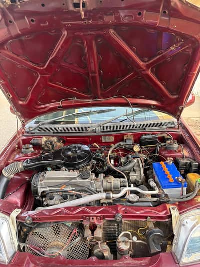 a maroon Suzuki, cultus in a very good condition. . .