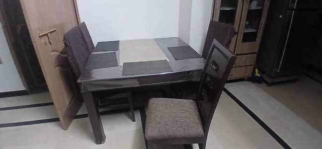 Dinning table with 4 chairs  chairs are neat and clean