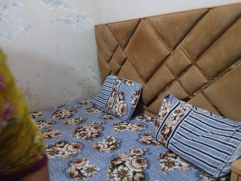 bed and side table with dressing 0