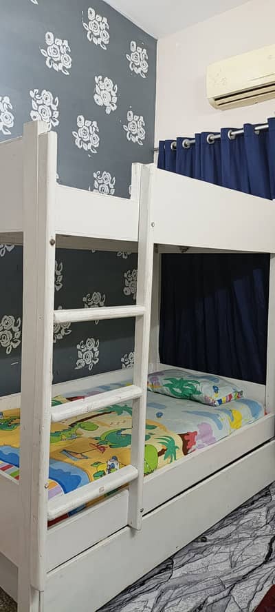 White bunk bed with big storage drawer