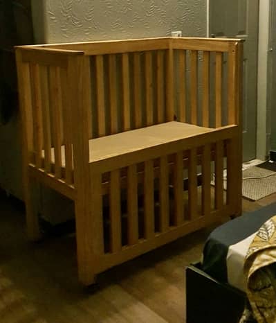 Used baby cot for sale with mattress