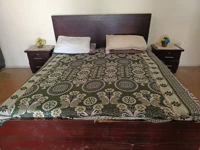 King size bed with side table and matrices