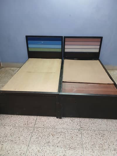 2 single beds for sale with mattresses.