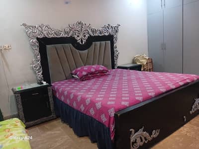 used bed, with side tables, or dressing