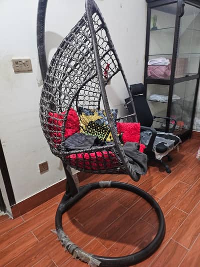 Swing Chair with red cushion