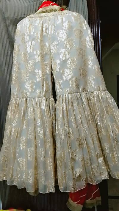 Red nd Golden contrast fancy embroided dress1 time used for four h