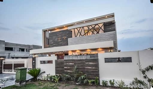 SYED BROTHERS PROUDLY OFFERS: 1-Kanal Elegant And Fully Maintained Modern Brand New Bungalow Is Available In The Best Block Of DHA Lahore.