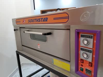 pizza oven south star, dough mixer, prep table, deep fryer, food bags