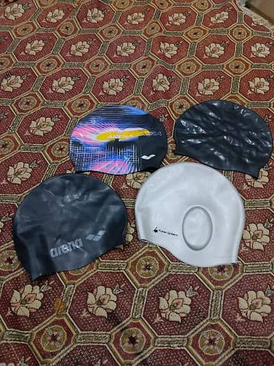 swimming caps and goggles