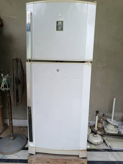 Dawlance Medium-sized working Fridge with wooden stand