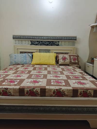 bed with corners and dressing table