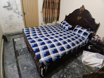 wooden two bed for sale