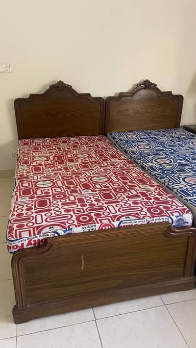 2 Single beds and a side table