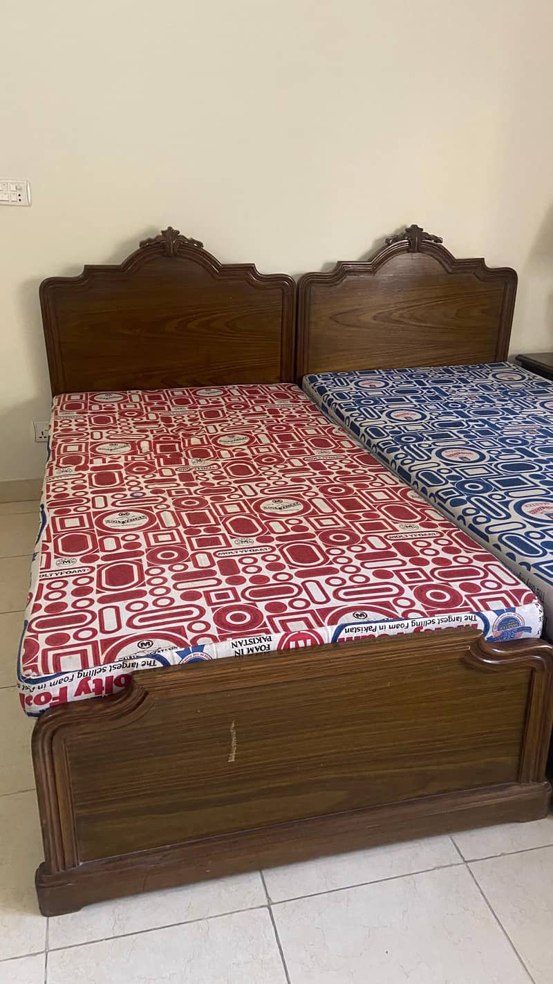 2 Single beds and a side table 0