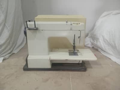 A well-maintained sewing machine is available for sale. (0300-2399063)