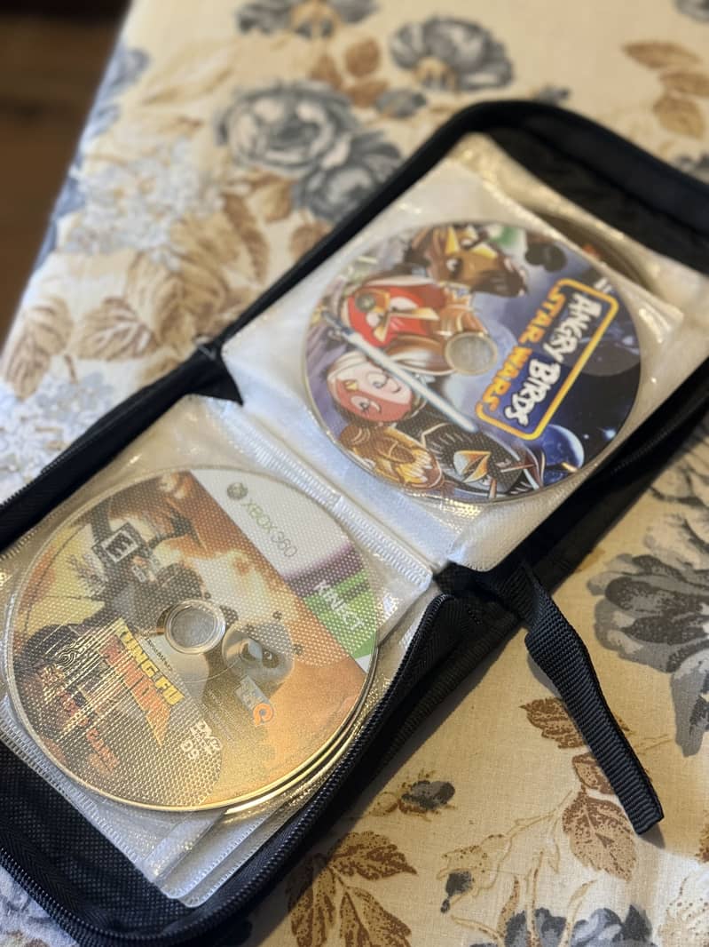 Xbox 360 with controller + games cds 8